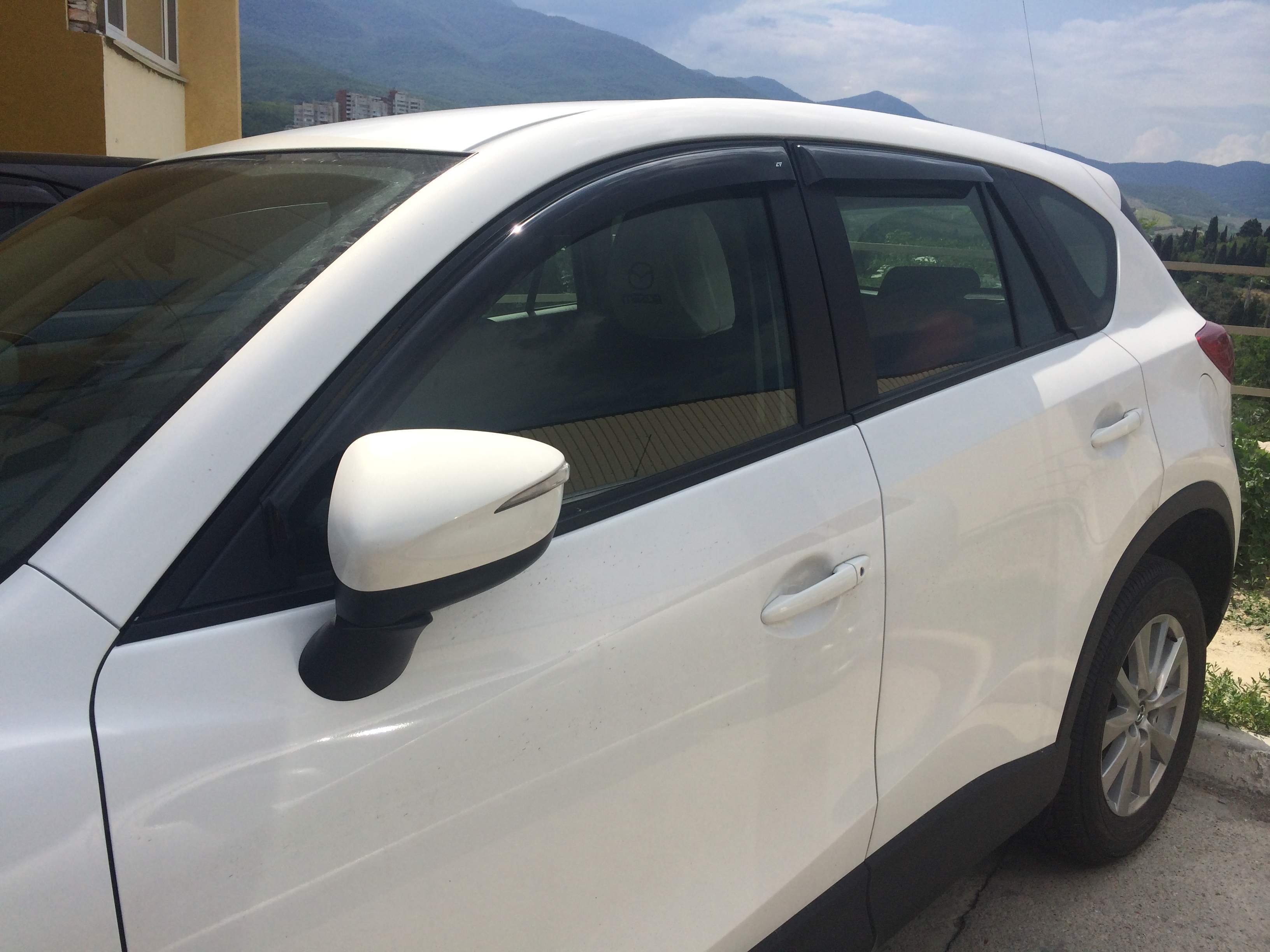 Дефлектори вікон вставні Mazda 323 BJ передні 1998-2002 4