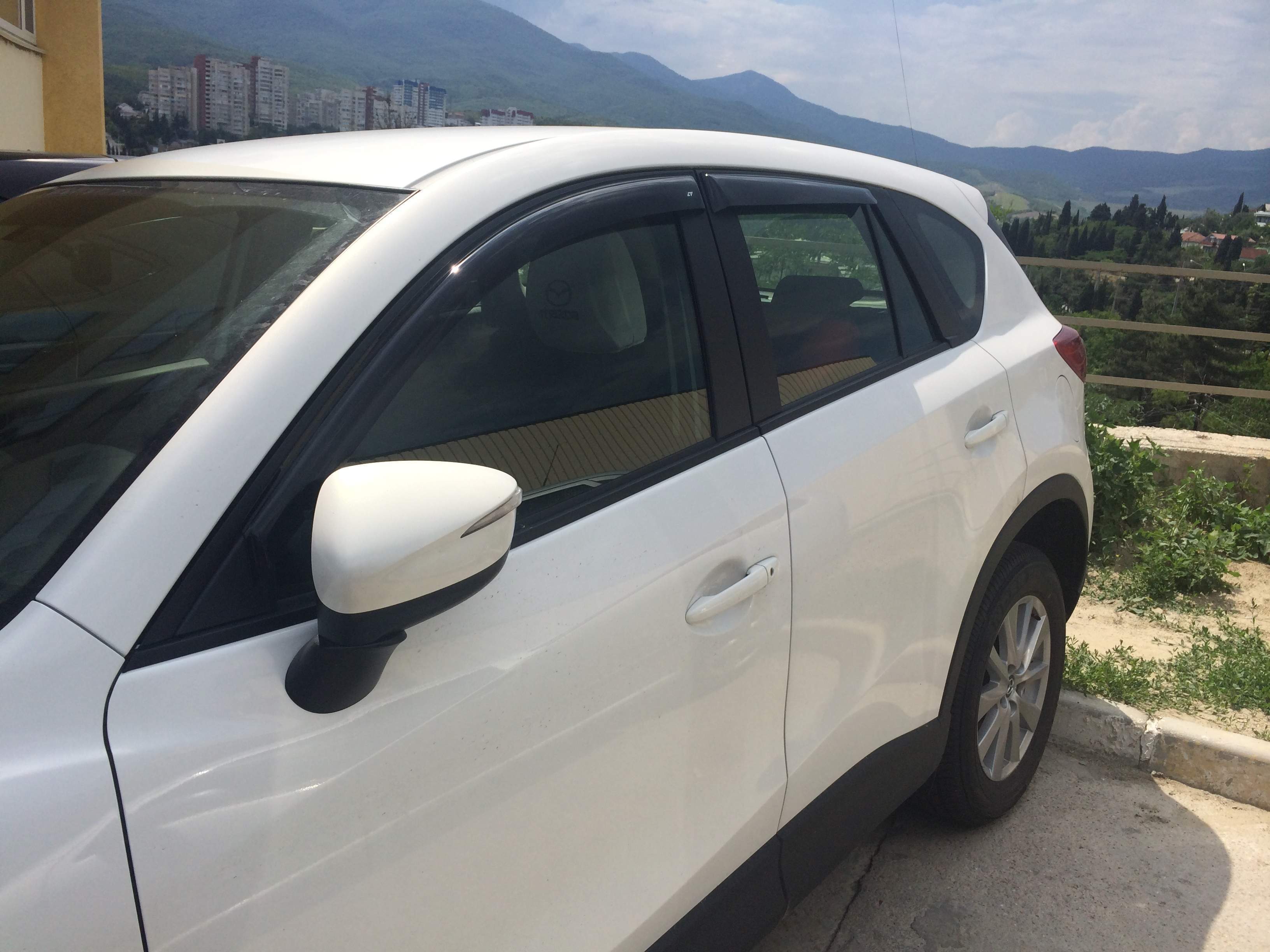 Дефлектори вікон вставні Mazda 323 BJ передні 1998-2002 3